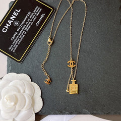 Perfume bottle pendant necklace